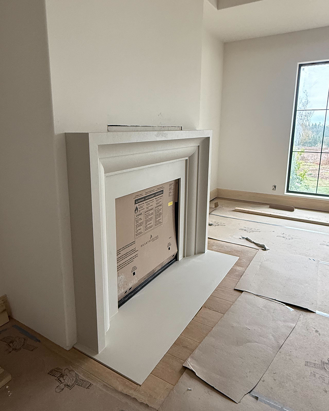 Amalfi cast limestone surround — side profile installed in Home