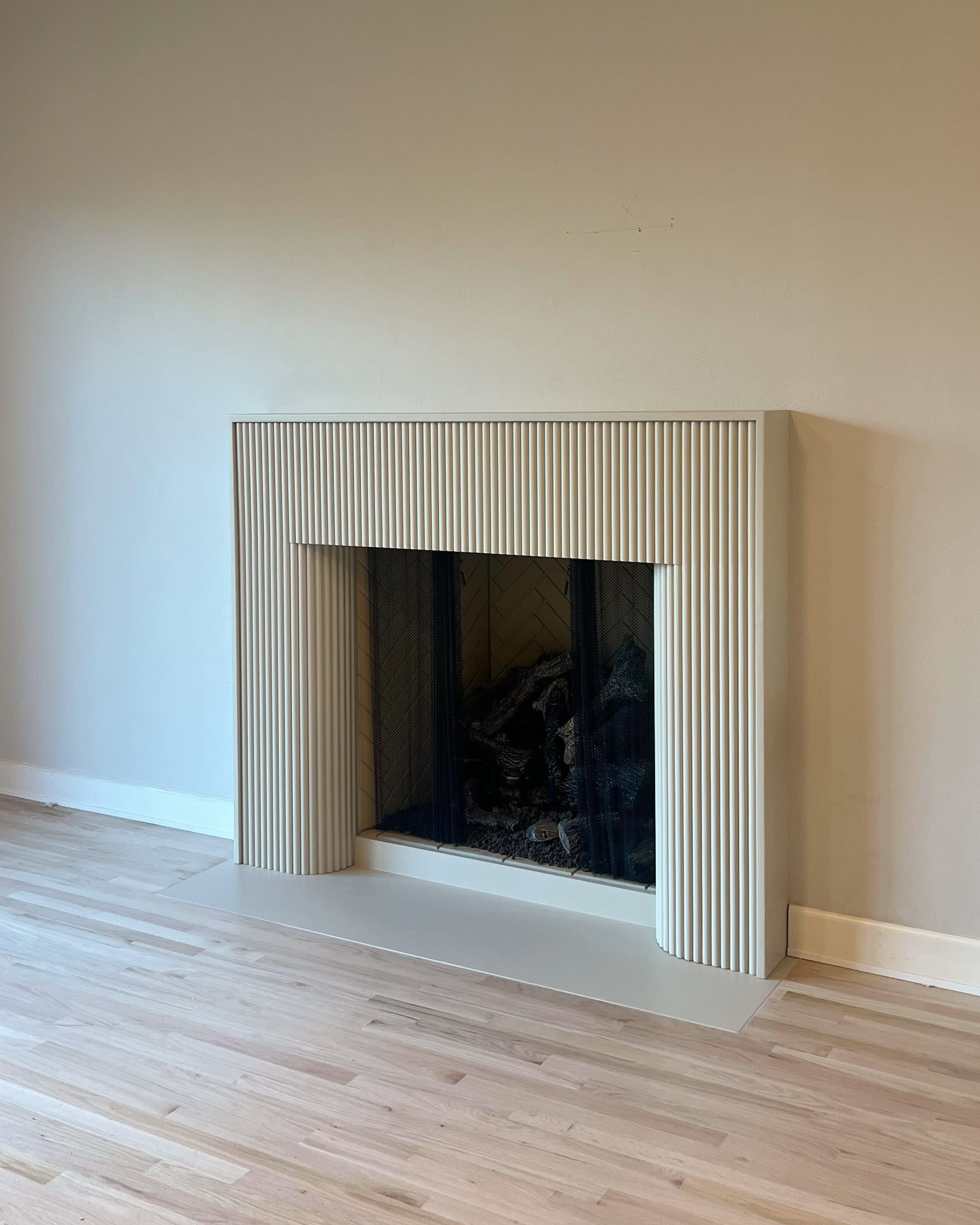 Florenza cast limestone surround installed in a beautiful home.