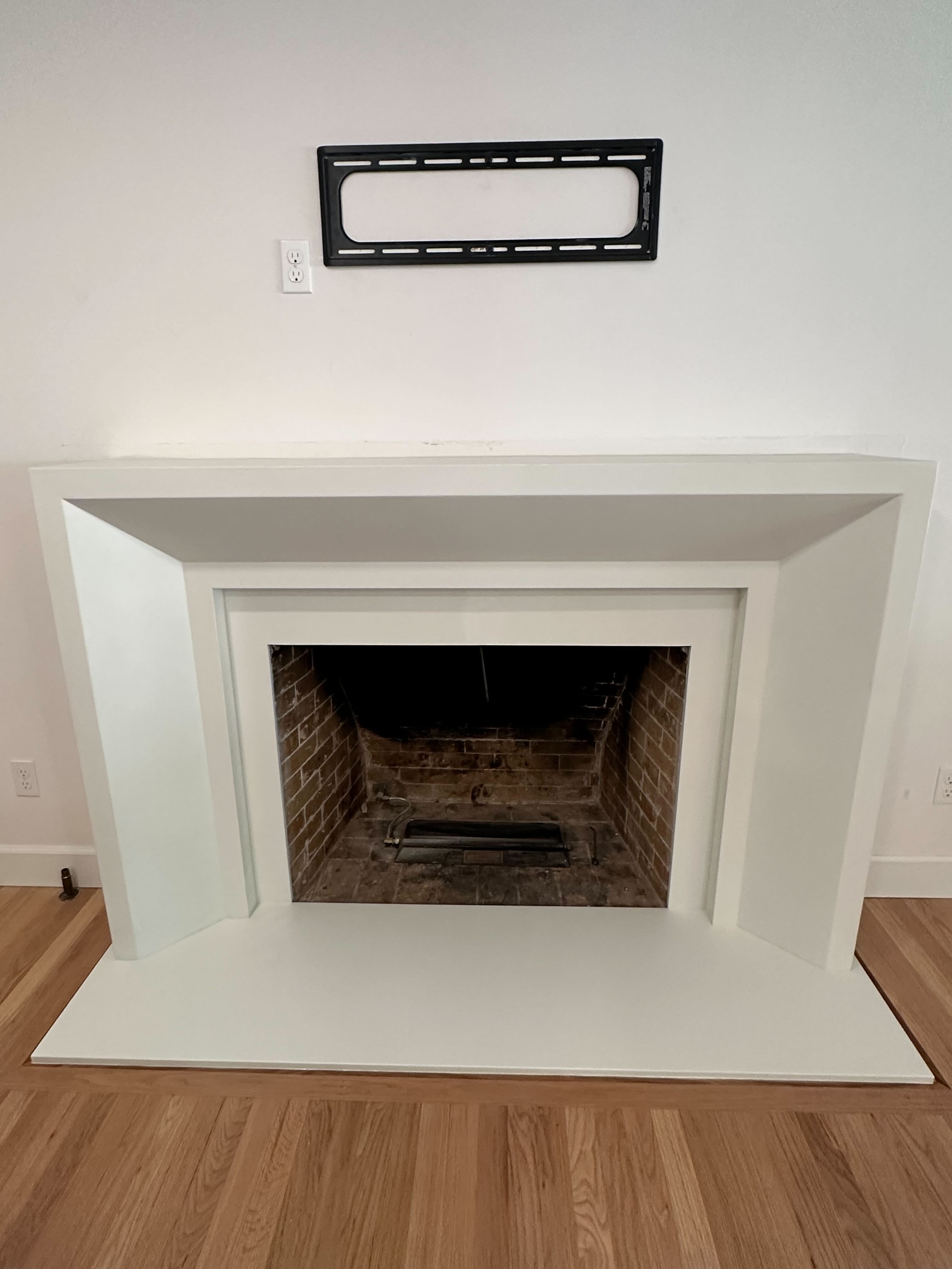 Newport cast stone fireplace surround installed in a client's home