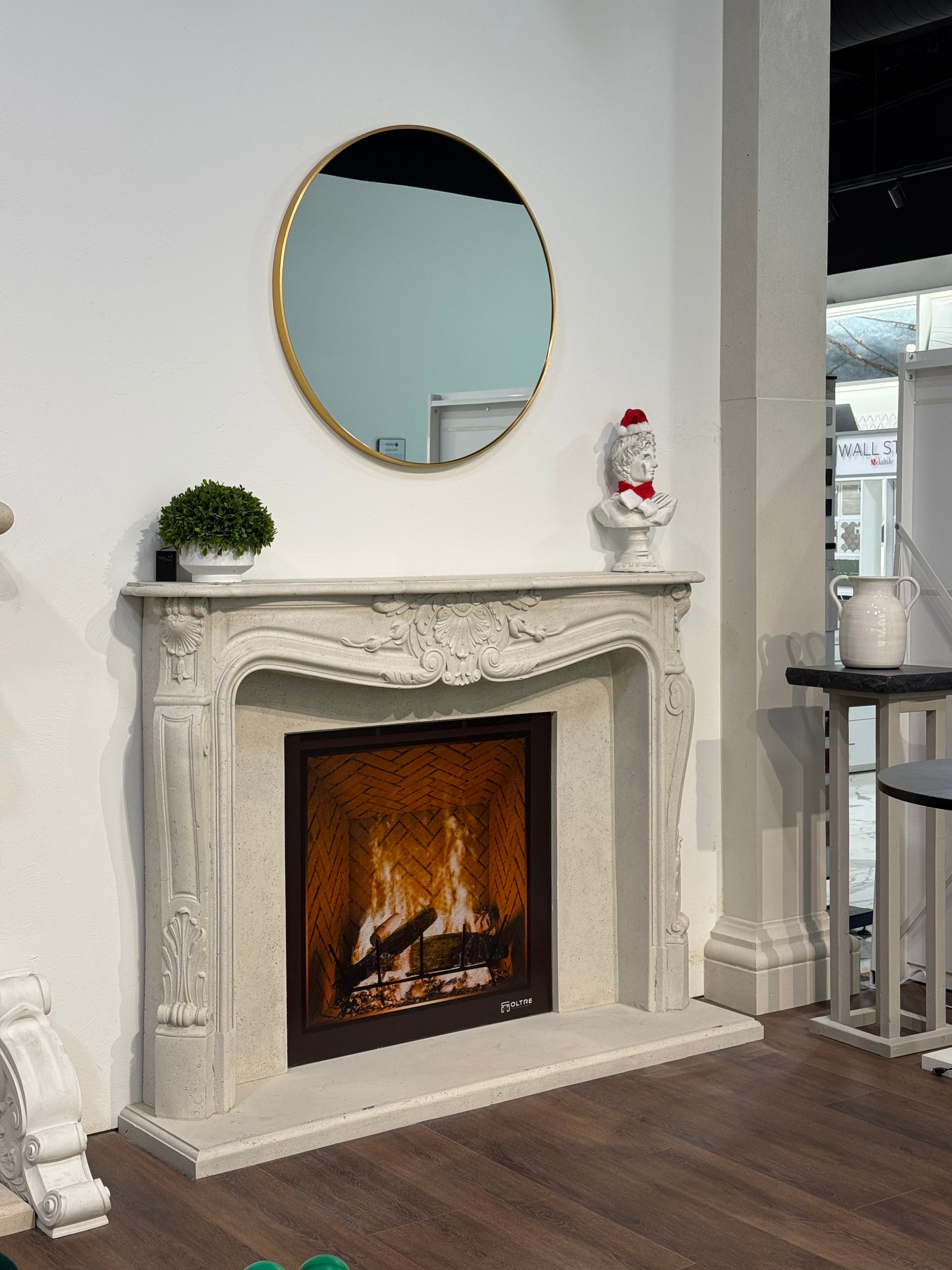 Louis XV cast stone fireplace surround — installed product photo
