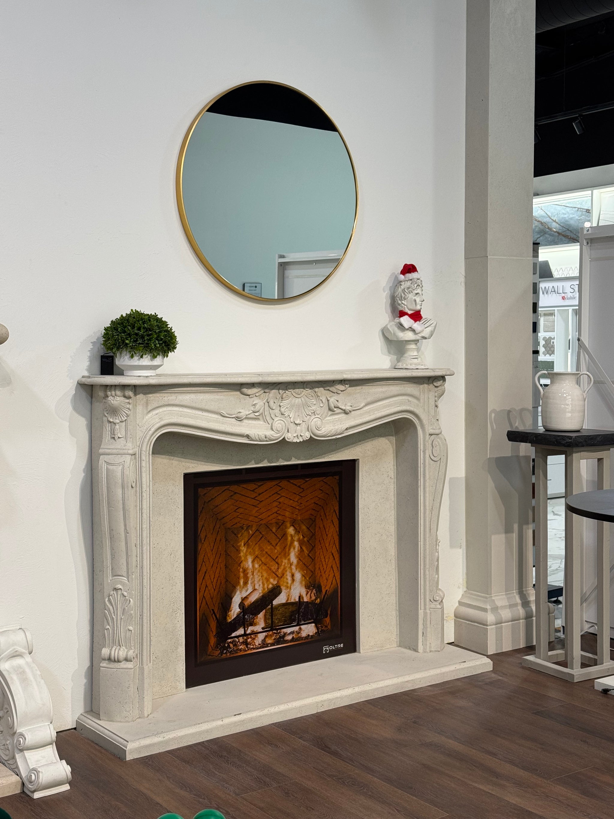 Louis XV cast stone fireplace surround — installed product photo