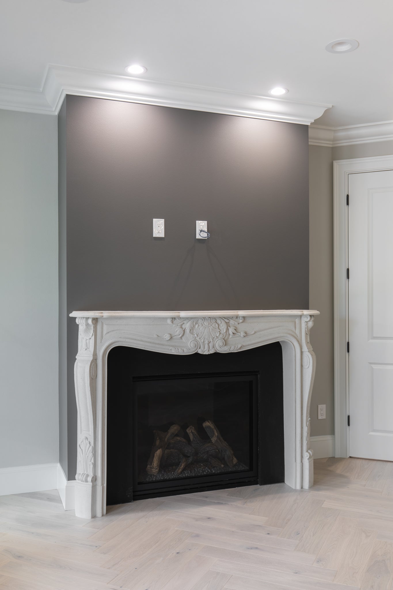 Louis XV cast limestone surround in the River Road Villa — full installation view