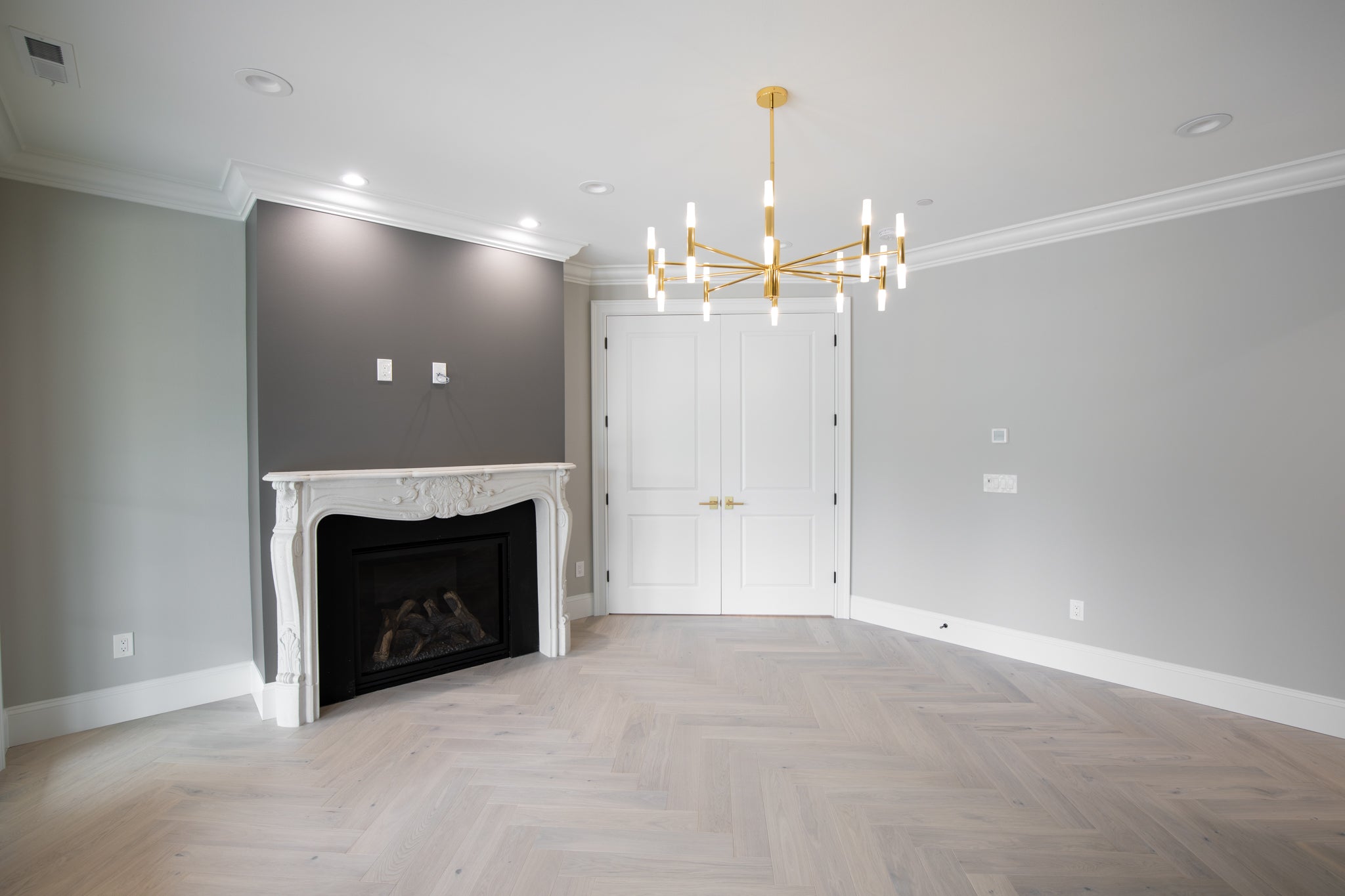 Louis XV cast limestone surround in the River Road Villa — full installation view
