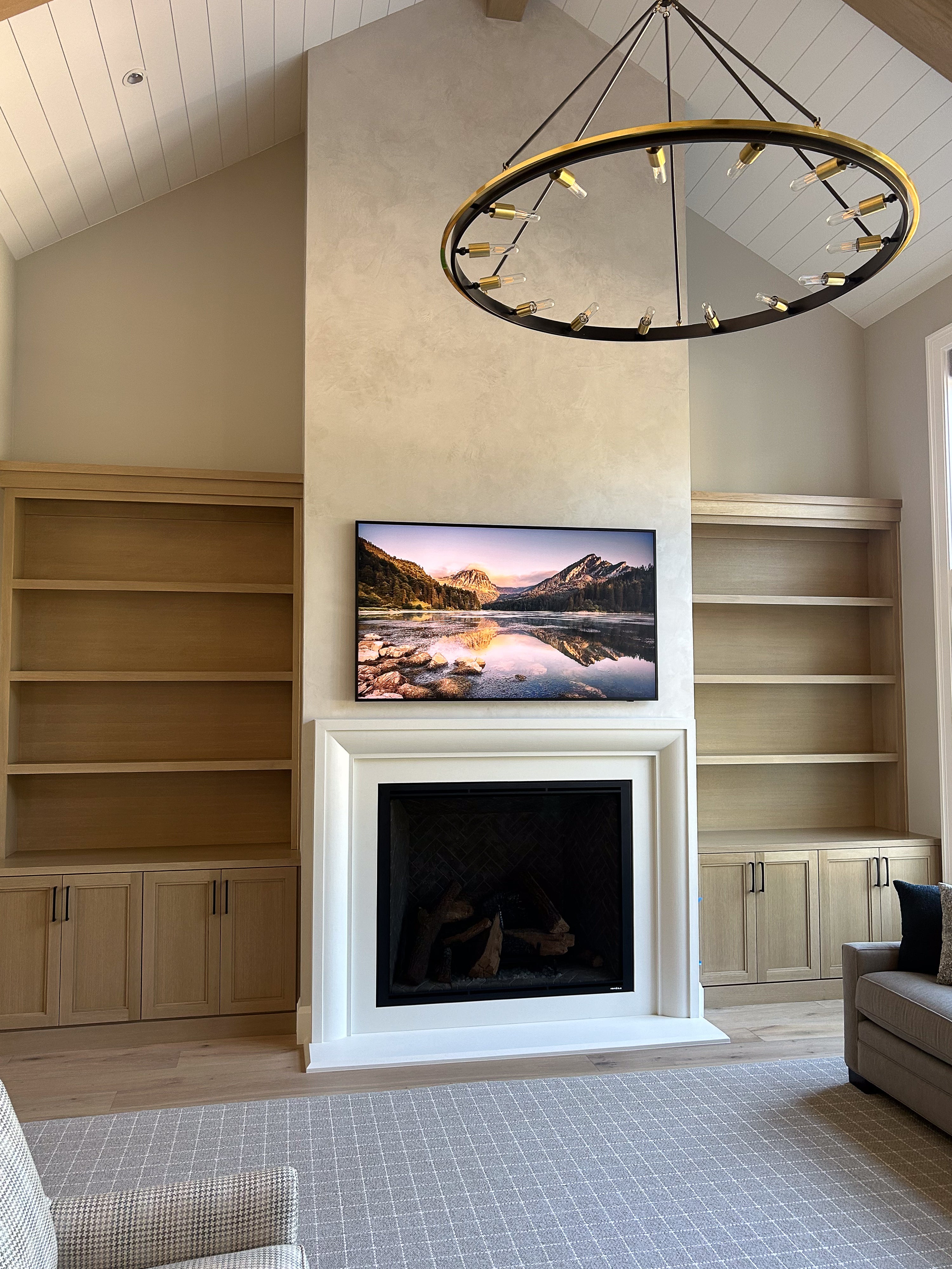 Verona cast limestone fireplace surround installed in a finished living space