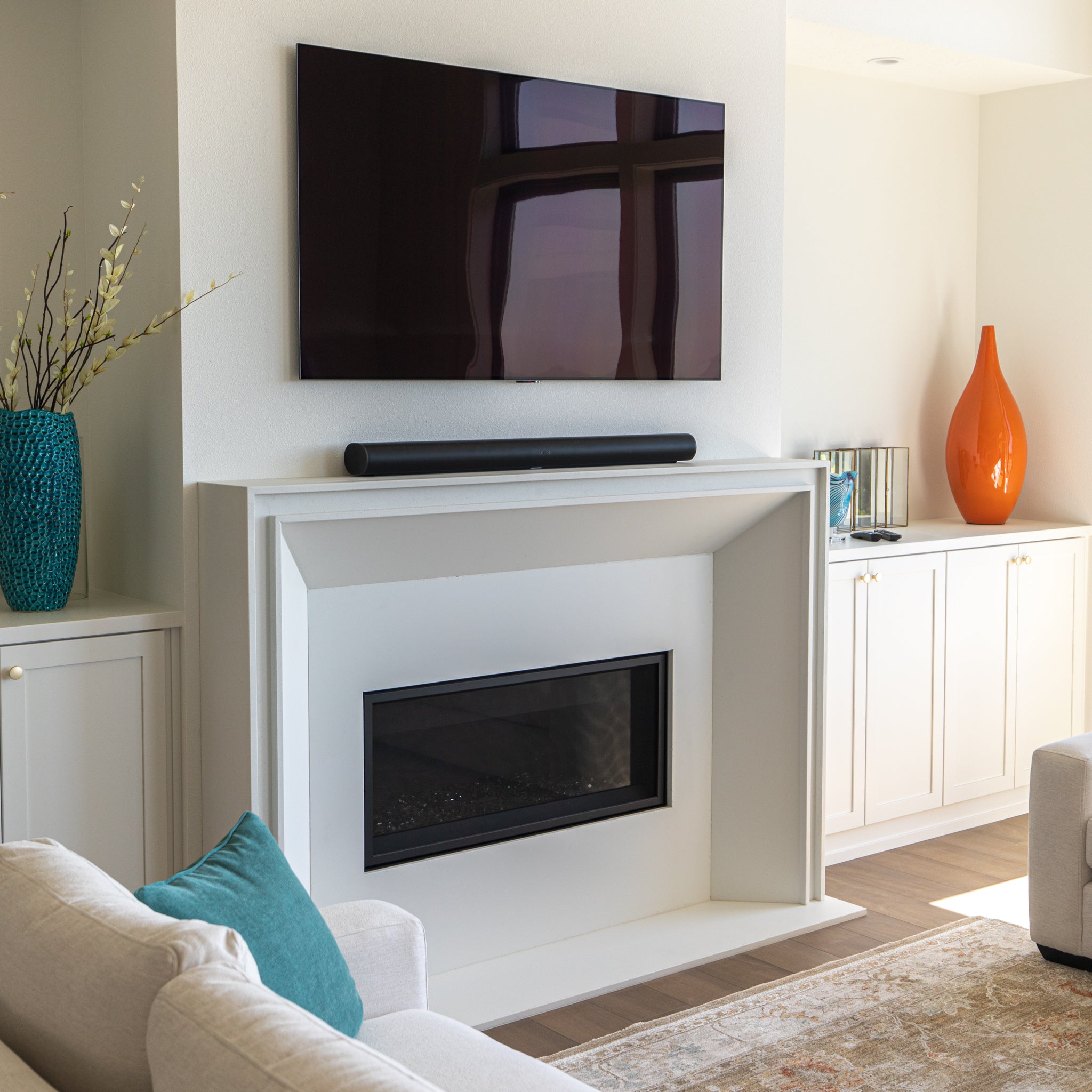 Lucca cast limestone fireplace surround installed in a finished living space
