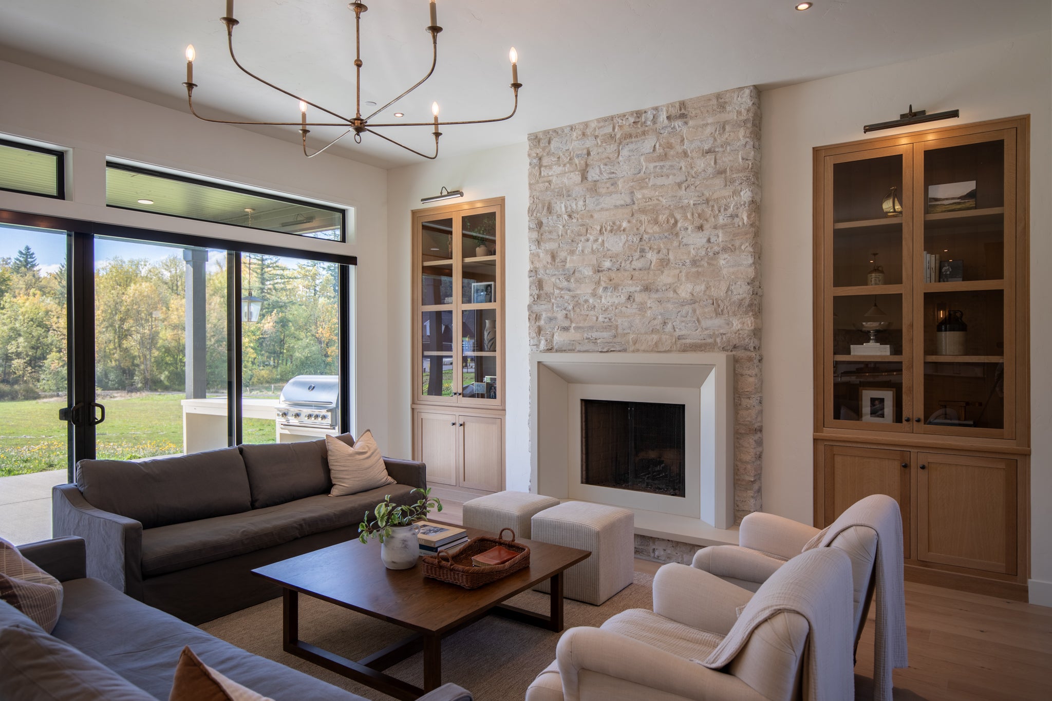 Milan cast limestone fireplace surround installed in a finished living space