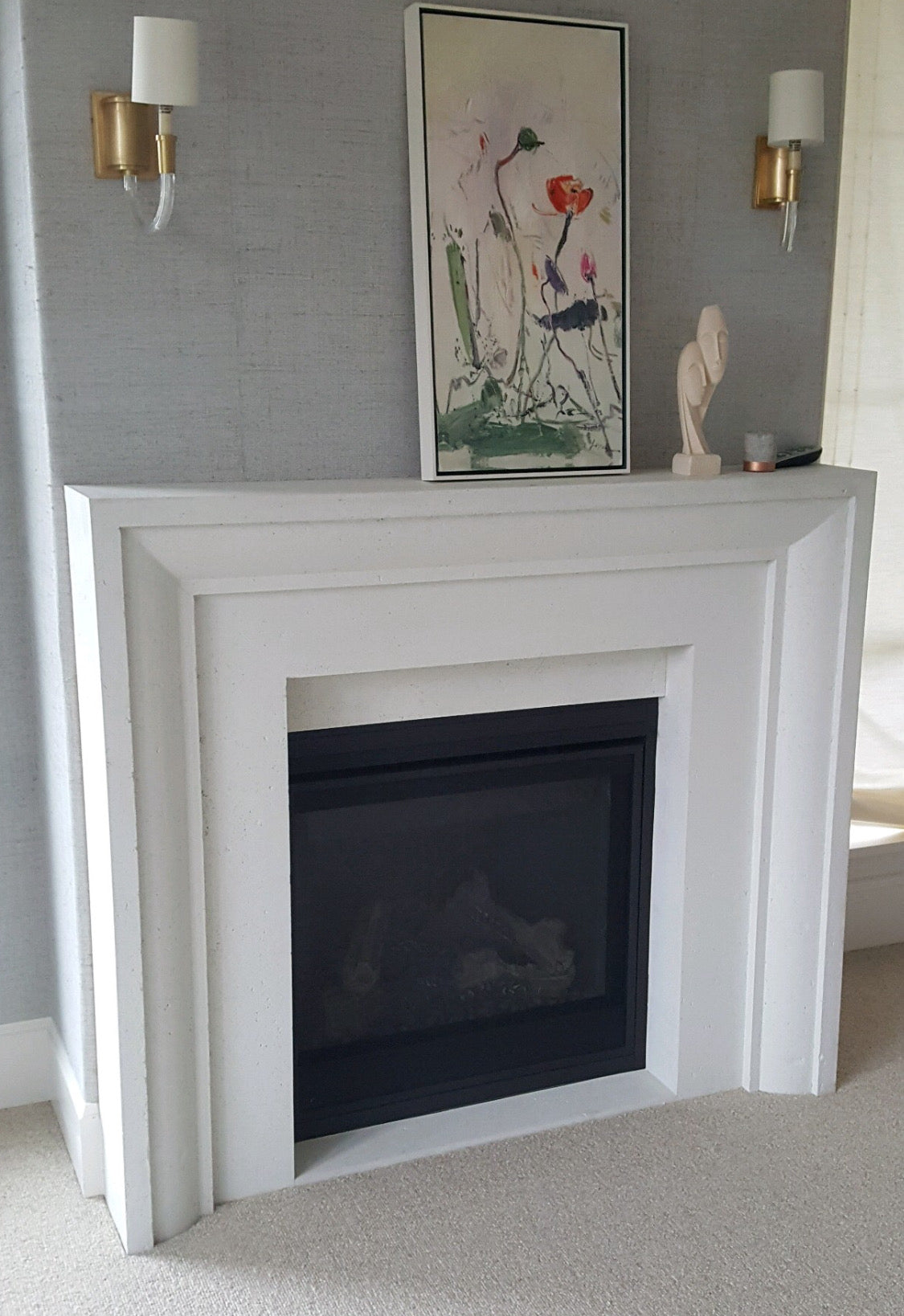 Verona cast stone fireplace surround — installed product photo