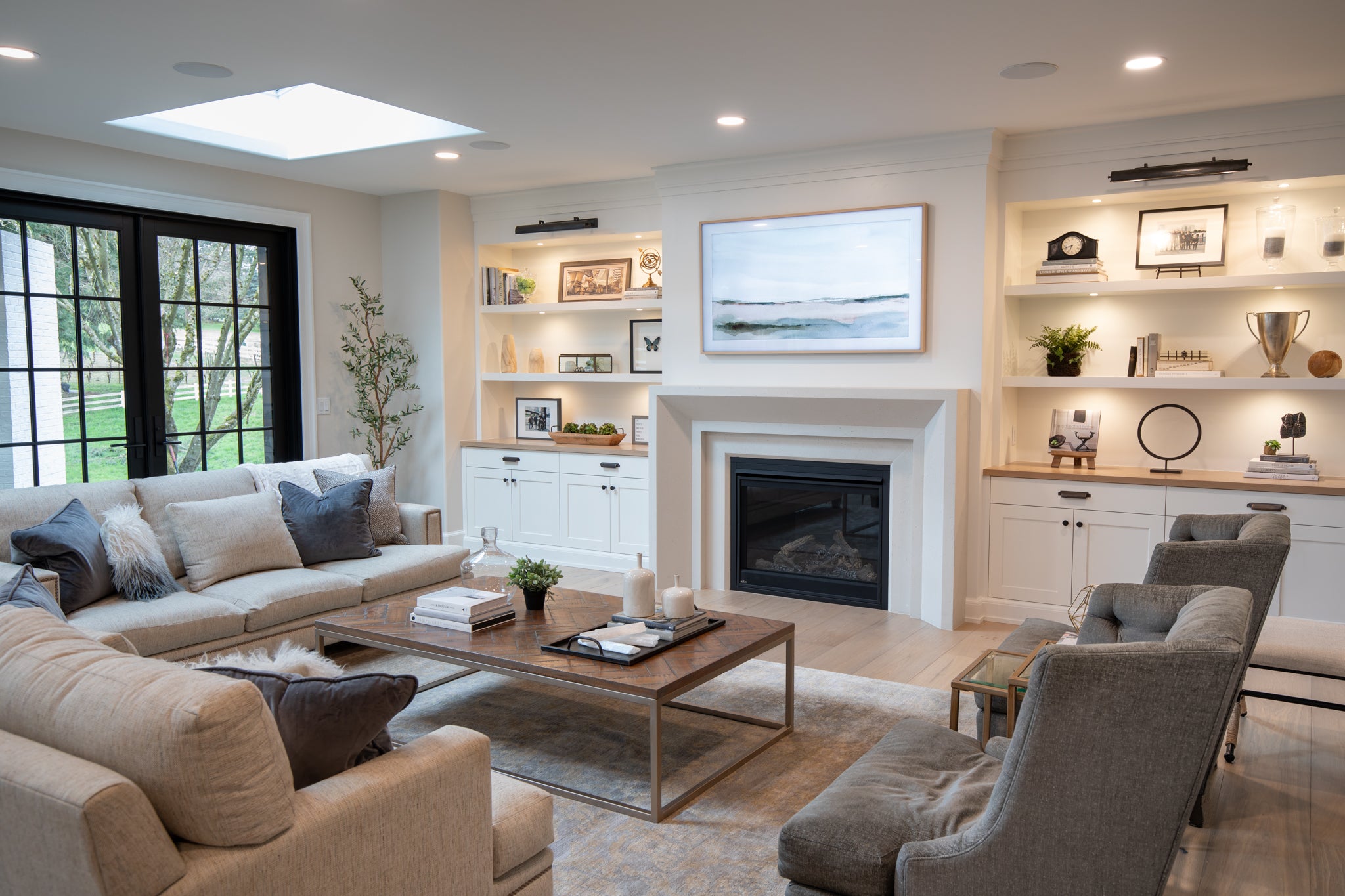 Newport cast stone fireplace surround in a bright, modern living room.